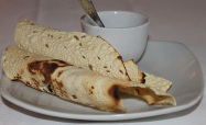Papadum also known as Papad (in North India), is a thin Indian crispy cuisine sometimes described as a cracker or flatbread.